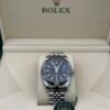 Rolex — esfera negra, bisel estriado y brazalete jubilee de acero