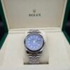Rolex — esfera azul, bisel estriado y brazalete jubilee de acero