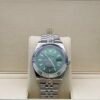Rolex — esfera verde con calendario anual, bisel estriado y brazalete jubilee de acero