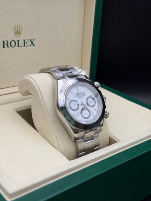 Rolex — cronógrafo con esfera azul hielo, bisel negro y brazalete de acero