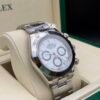 Rolex — cronógrafo con esfera azul hielo, bisel negro y brazalete de acero