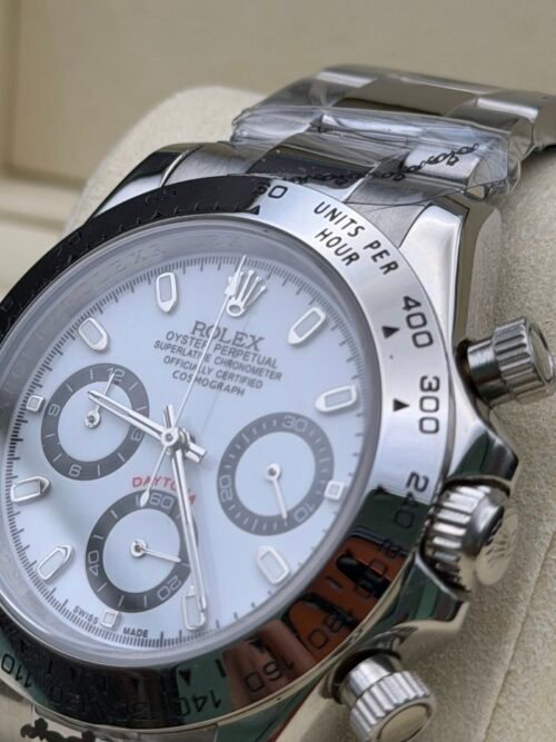Rolex — cronógrafo con esfera azul hielo, bisel negro y brazalete de acero