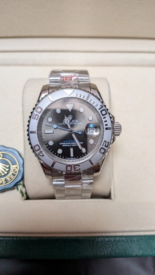 Rolex — esfera gris oscura, bisel de acero y brazalete de acero