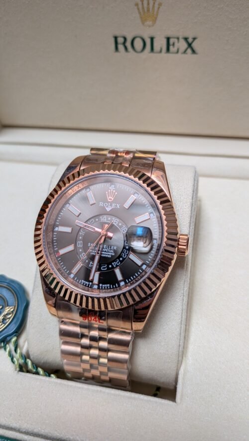 Rolex — esfera negra con calendario anual, caja oro rosa y brazalete jubilee oro rosa