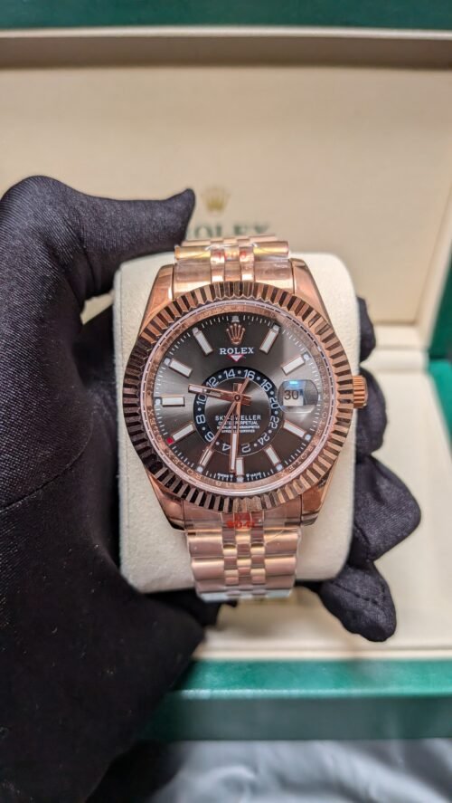 Rolex — esfera negra con calendario anual, caja oro rosa y brazalete jubilee oro rosa