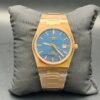 Tissot — esfera azul texturizada, caja y brazalete dorados