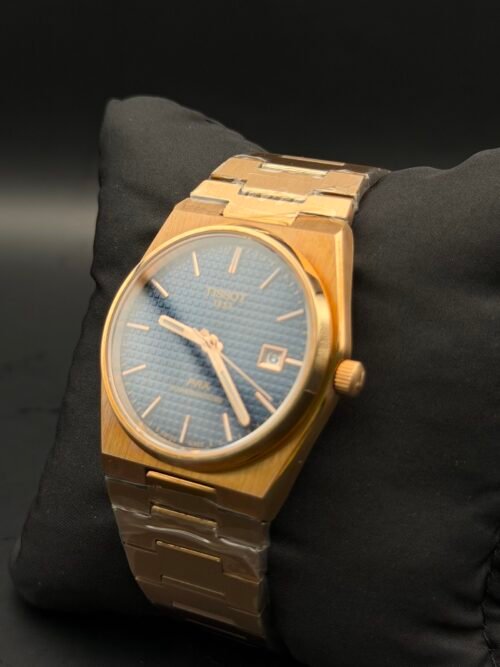 Tissot — esfera azul texturizada, caja y brazalete dorados
