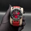Tissot — cronógrafo con esfera negra y subesferas rojas, correa de caucho roja