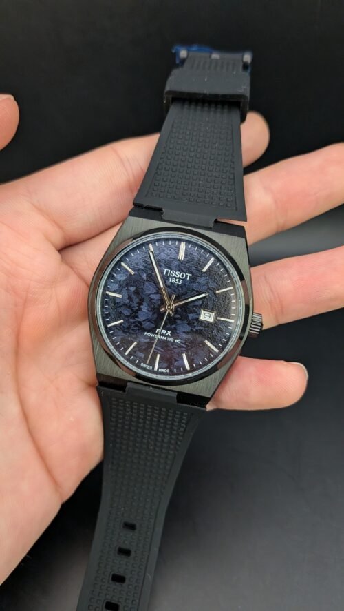 Tissot — esfera azul texturizada, caja negra y correa de caucho negra