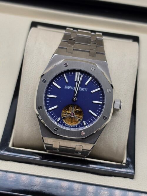 Audemars Piguet — esfera azul con tourbillon a la vista y brazalete de acero