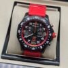 Breitling — cronógrafo negro con detalles rojos y correa roja