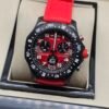 Breitling — cronógrafo con esfera roja, caja negra y correa roja