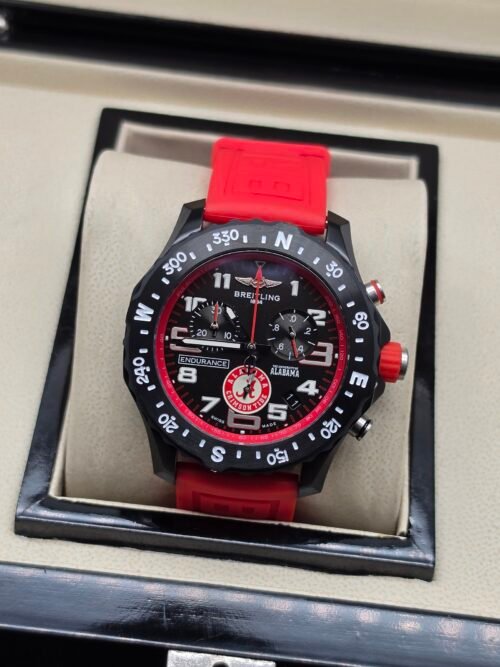 Breitling — cronógrafo negro con aro rojo y correa roja