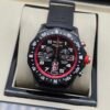 Breitling — cronógrafo negro con aro rojo y correa negra