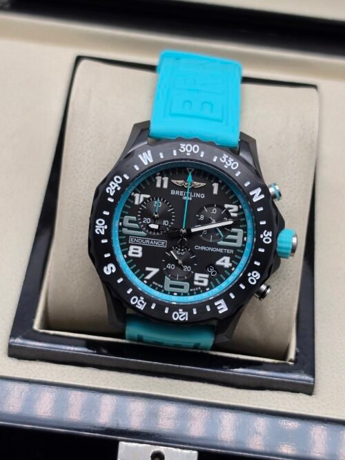 Breitling — cronógrafo negro con aro turquesa y correa turquesa