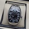 Franck Muller — caja tonneau de acero, esfera negra con números grandes y brazalete de acero