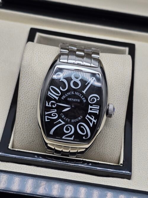 Franck Muller — caja tonneau de acero, esfera negra con números grandes y brazalete de acero