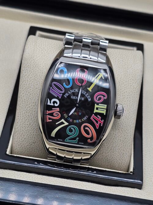 Franck Muller — caja tonneau de acero, esfera negra con números de colores y brazalete de acero