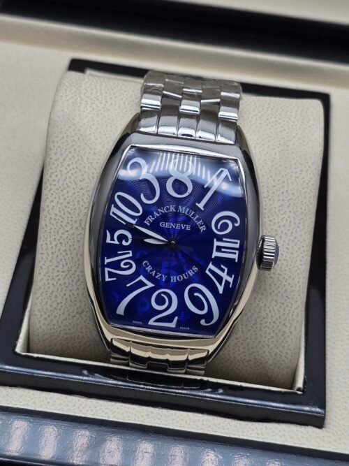 Franck Muller — caja tonneau de acero, esfera azul con números grandes y brazalete de acero