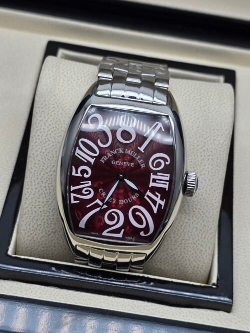 Franck Muller — caja tonneau de acero, esfera vinotinto con números grandes y brazalete de acero