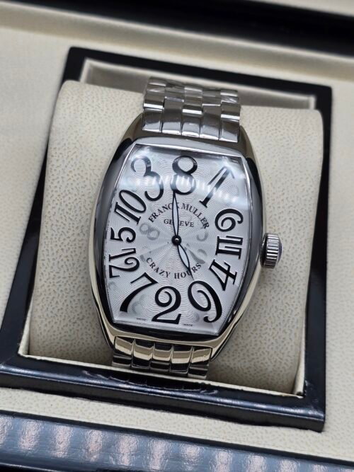 Franck Muller — caja tonneau de acero, esfera blanca con números grandes y brazalete de acero