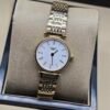 Longines — esfera blanca, caja dorada y brazalete dorado