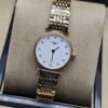 Longines — esfera blanca con índices dorados y brazalete dorado