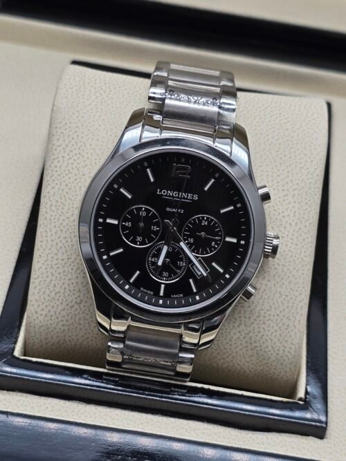 Longines — cronógrafo con esfera negra y brazalete de acero