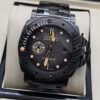 Panerai — caja de carbono, esfera negra con detalles naranjas y brazalete negro
