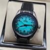 Omega — esfera turquesa degradada y correa de cuero negra