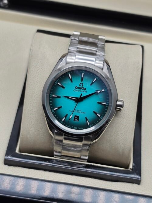 Omega — esfera turquesa degradada y brazalete de acero
