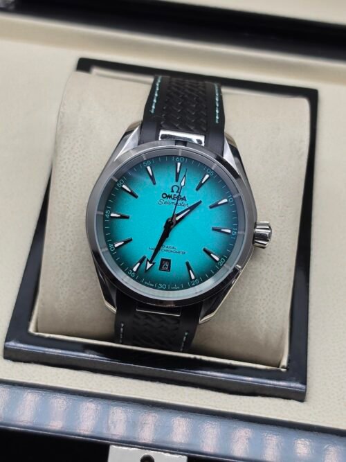 Omega — esfera turquesa degradada y correa de caucho negra