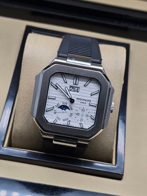 Patek Philippe — caja octagonal, esfera blanca con fases lunares y correa de caucho negra