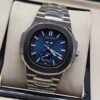 Patek Philippe — esfera azul con fases lunares y brazalete de acero
