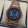 Patek Philippe — caja oro rosa, esfera azul con calendario y brazalete oro rosa