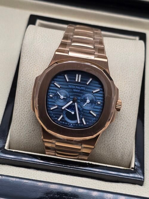 Patek Philippe — caja oro rosa, esfera azul con calendario y brazalete oro rosa
