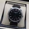 Patek Philippe — esfera negra, caja de acero y correa de cuero negra