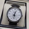 Patek Philippe — esfera blanca con calendario y fases lunares, correa de cuero negra