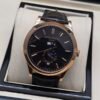 Patek Philippe — caja oro rosa, esfera negra con calendario y fases lunares, correa de cuero negra