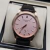 Patek Philippe — caja oro rosa, esfera rosada y correa de cuero negra