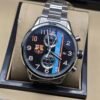 TAG Heuer — cronógrafo con esfera negra con franjas de colores y escudo de fútbol, brazalete de acero