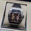 Richard Mille — esfera con dragón y tigre dorados, caja de acero y correa de caucho negra
