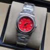 Rolex — esfera roja y brazalete de acero