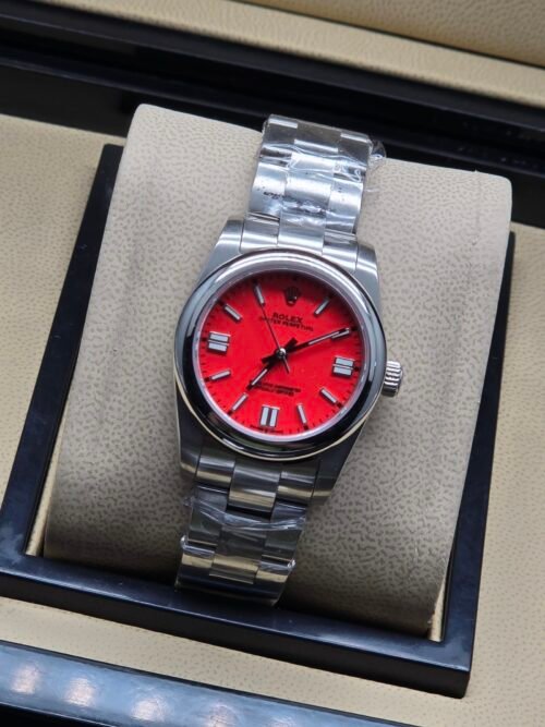 Rolex — esfera roja y brazalete de acero
