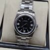 Rolex — esfera negra y brazalete jubilee de acero