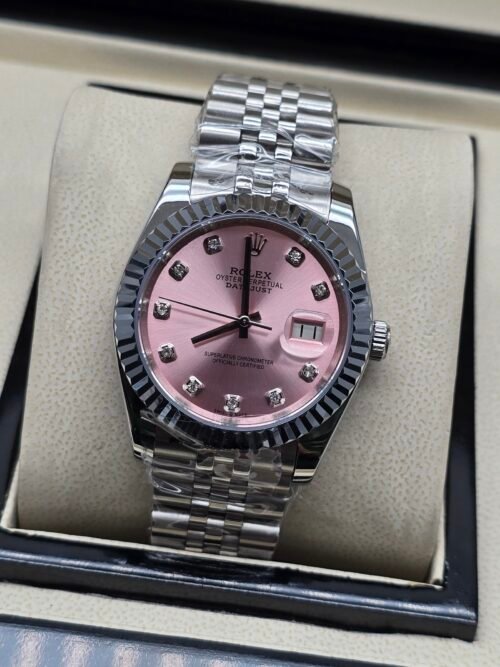 Rolex — esfera rosada con brillantes, bisel estriado y brazalete jubilee de acero
