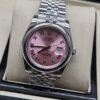 Rolex — esfera rosada con números romanos y brazalete jubilee de acero