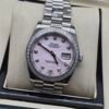 Rolex — esfera rosada clara con brillantes, bisel de brillantes y brazalete jubilee de acero