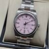 Rolex — esfera rosada y brazalete de acero
