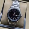 TAG Heuer — esfera negra y brazalete de acero